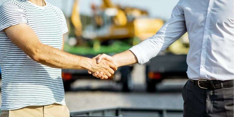 Farmer buying farm equipment.