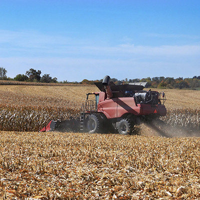 A tractor driving in a field.