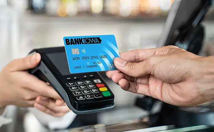 person playing with debit card