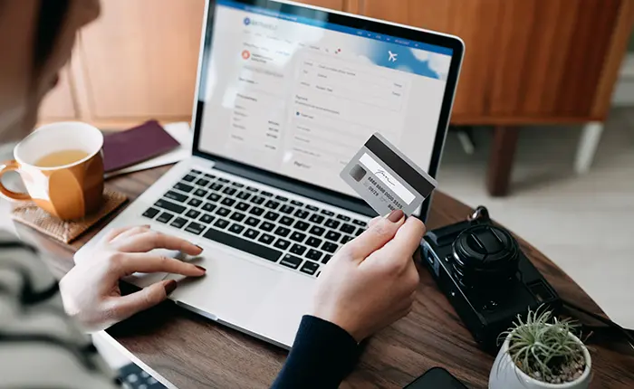 woman on laptop with credit card
